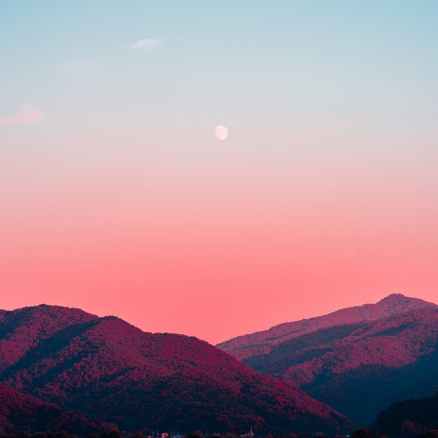 photography of body of water and mountains