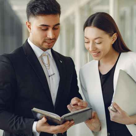 concentrated diverse coworkers talking about project